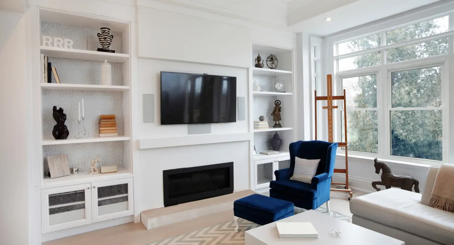 A white living room with new double-hung windows.