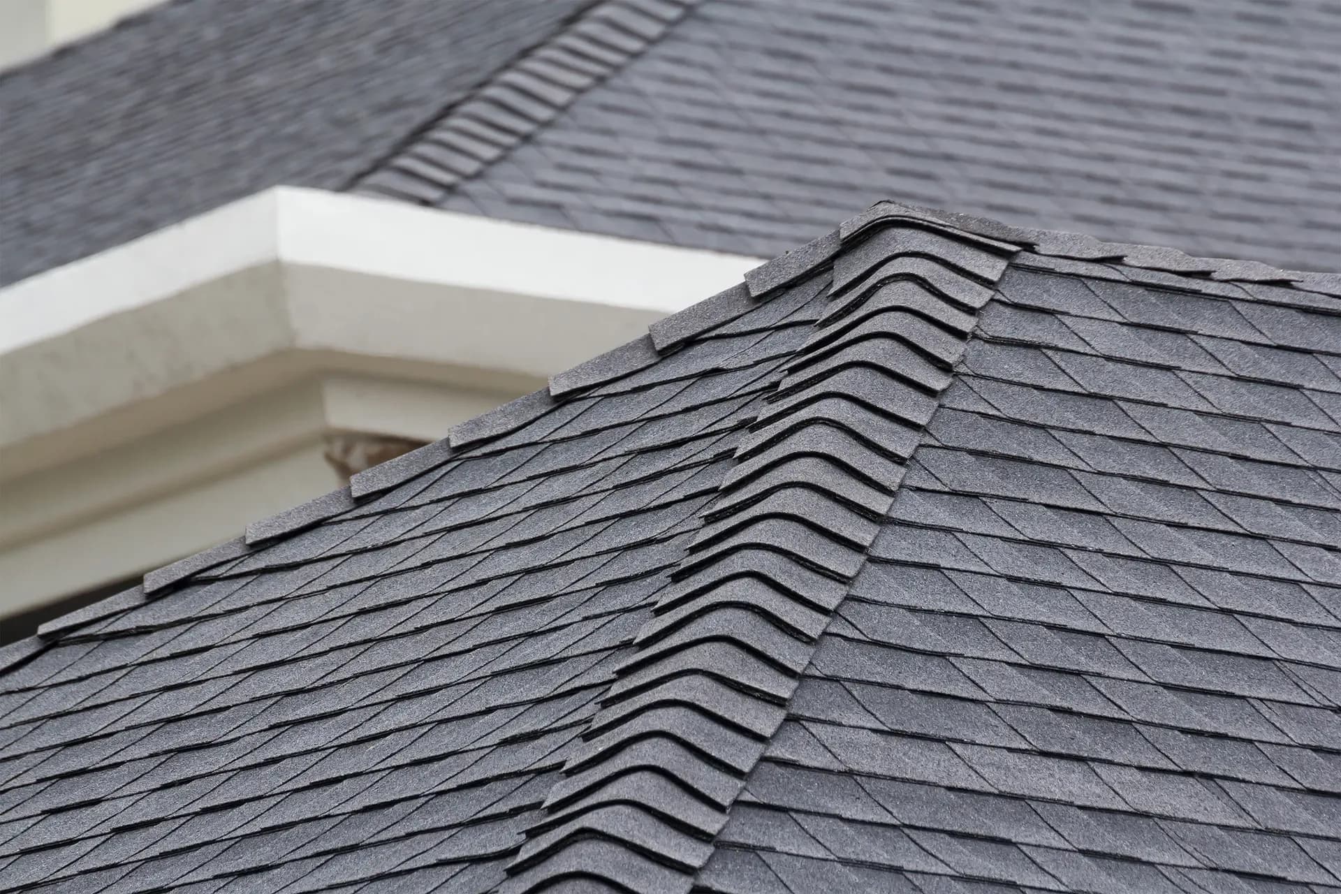 New gray shingle residential roofing.