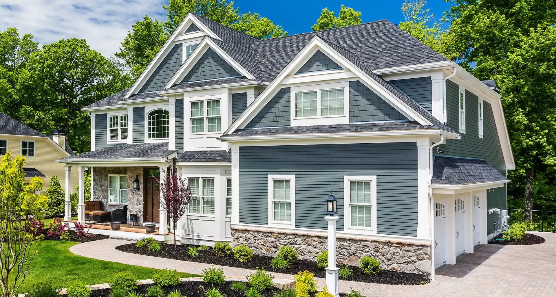 A blue and white house with James Hardie Siding.
